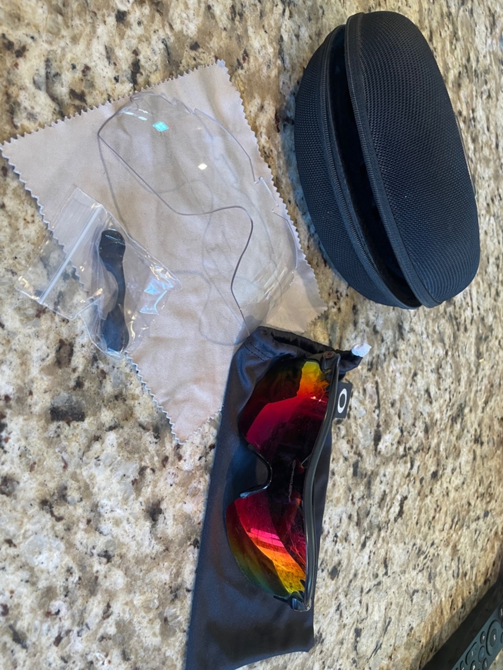 Oakley sunglasses with red-orange mirrored lens